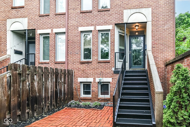 558 E Vermont St, Indianapolis, IN 46202 - doorway to property featuring brick siding