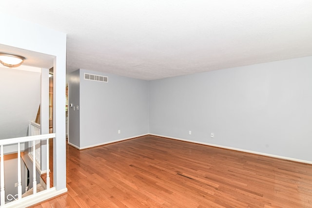 558 E Vermont St, Indianapolis, IN 46202 - unfurnished room with light wood-style flooring and baseboards