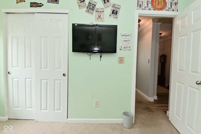 7515 Brattle Dr, Indianapolis, IN 46113 - unfurnished bedroom with carpet, baseboards, ornamental molding, and a closet