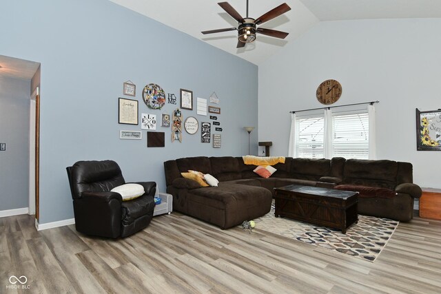 7515 Brattle Dr, Indianapolis, IN 46113 - living area with high vaulted ceiling, ceiling fan, wood finished floors, and baseboards