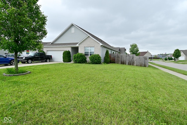 7515 Brattle Dr, Indianapolis, IN 46113 - view of front of property with a garage and driveway