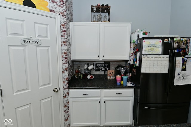 7515 Brattle Dr, Indianapolis, IN 46113 - kitchen with freestanding refrigerator and white cabinetry