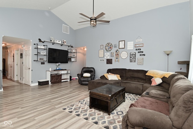 7515 Brattle Dr, Indianapolis, IN 46113 - living area with light wood-style flooring, a ceiling fan, high vaulted ceiling, and baseboards