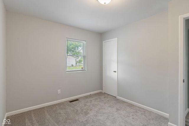 1002 Collier St, Indianapolis, IN 46241 - unfurnished room featuring carpet flooring and baseboards