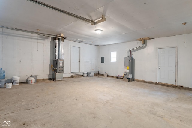 1002 Collier St, Indianapolis, IN 46241 - garage featuring heating unit, gas water heater, and electric panel