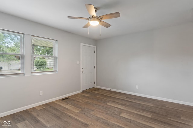 1002 Collier St, Indianapolis, IN 46241 - empty room featuring baseboards, wood finished floors, and a ceiling fan