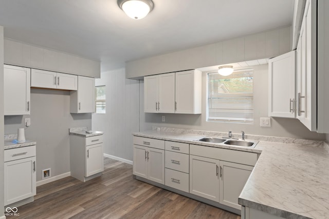 1002 Collier St, Indianapolis, IN 46241 - kitchen with a sink, dark wood-style flooring, white cabinetry, and baseboards