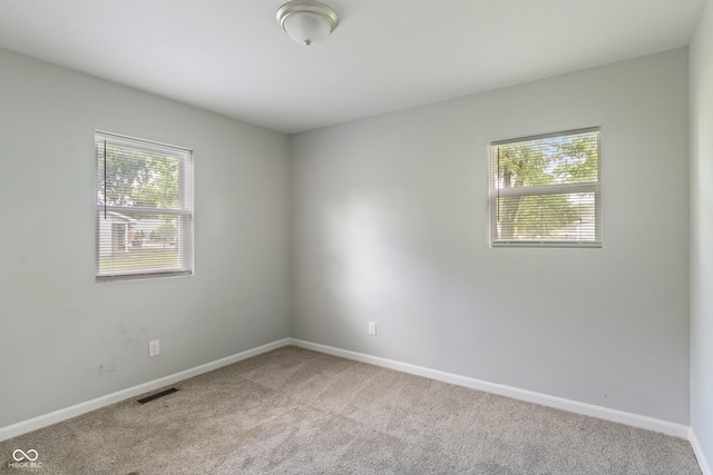 1002 Collier St, Indianapolis, IN 46241 - carpeted empty room with baseboards