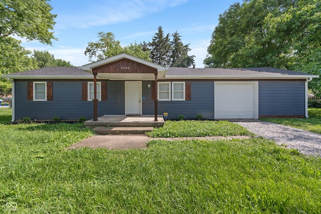 1002 Collier St, Indianapolis, IN 46241 - single story home featuring gravel driveway, a front lawn, an attached garage, and roof with shingles