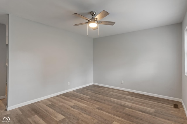 1002 Collier St, Indianapolis, IN 46241 - unfurnished room featuring baseboards, wood finished floors, and ceiling fan