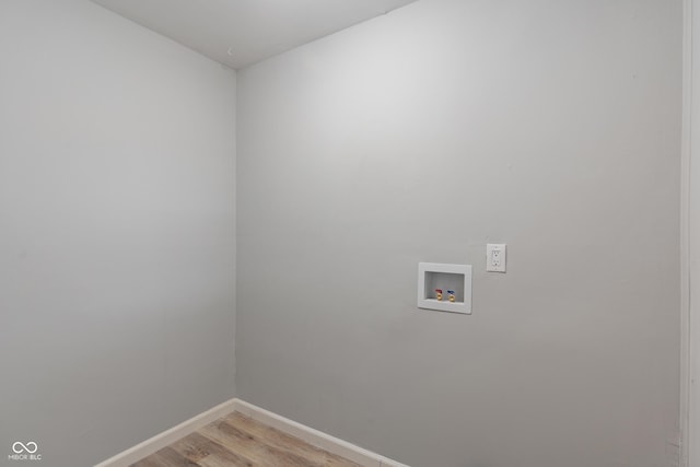 1002 Collier St, Indianapolis, IN 46241 - washroom with washer hookup, light wood-type flooring, and baseboards
