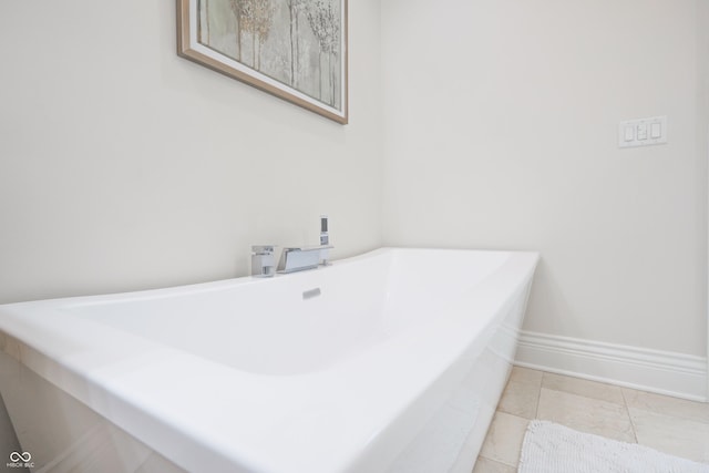 11911 W Grandview Dr, Columbus, IN 47201 - bathroom with a freestanding tub, a sink, and baseboards