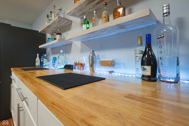 11911 W Grandview Dr, Columbus, IN 47201 - indoor dry bar featuring wood finished floors and black stovetop