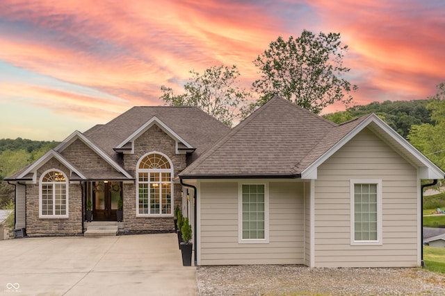 11911 W Grandview Dr, Columbus, IN 47201 - view of front of house with stone siding and roof with shingles