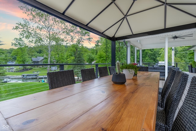 11911 W Grandview Dr, Columbus, IN 47201 - view of patio with view of scattered trees, a balcony, and ceiling fan