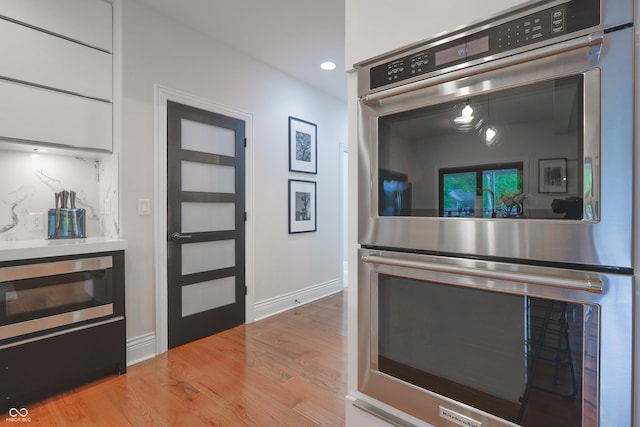 11911 W Grandview Dr, Columbus, IN 47201 - kitchen featuring stainless steel appliances, wood finished floors, recessed lighting, and baseboards