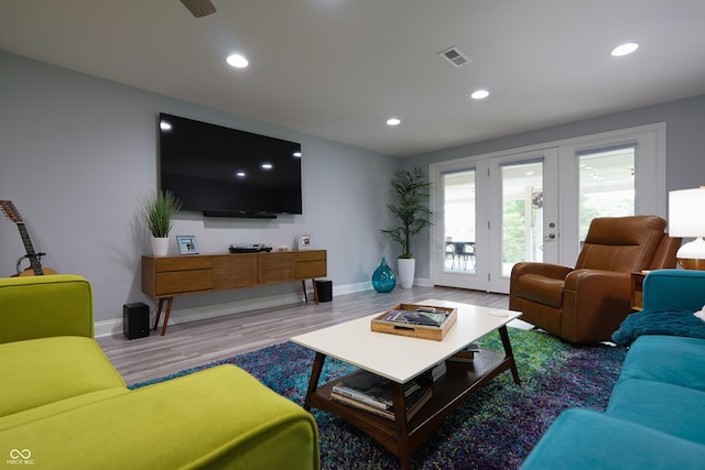 11911 W Grandview Dr, Columbus, IN 47201 - living area with baseboards, wood finished floors, recessed lighting, and french doors