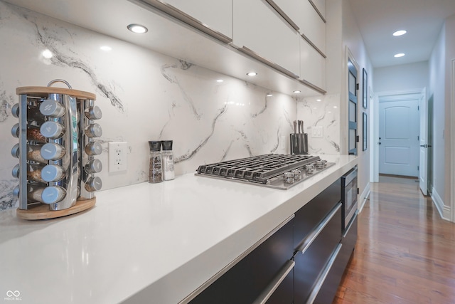 11911 W Grandview Dr, Columbus, IN 47201 - kitchen featuring appliances with stainless steel finishes, light countertops, white cabinets, recessed lighting, and wood finished floors