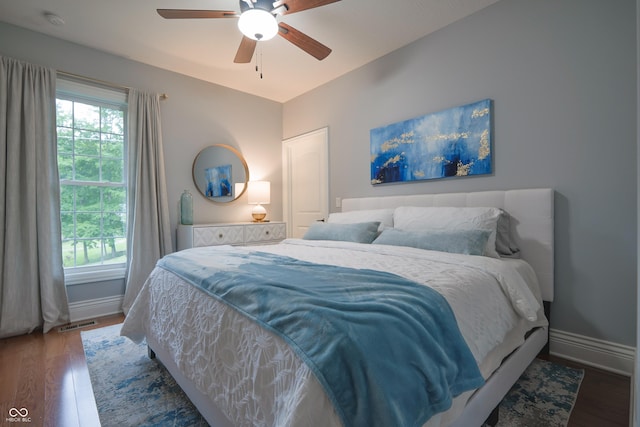 11911 W Grandview Dr, Columbus, IN 47201 - bedroom featuring baseboards, wood finished floors, and ceiling fan