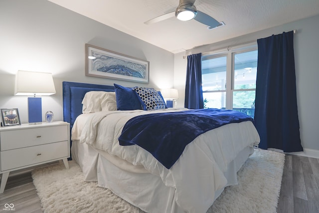 11911 W Grandview Dr, Columbus, IN 47201 - bedroom featuring light wood-style floors and a ceiling fan