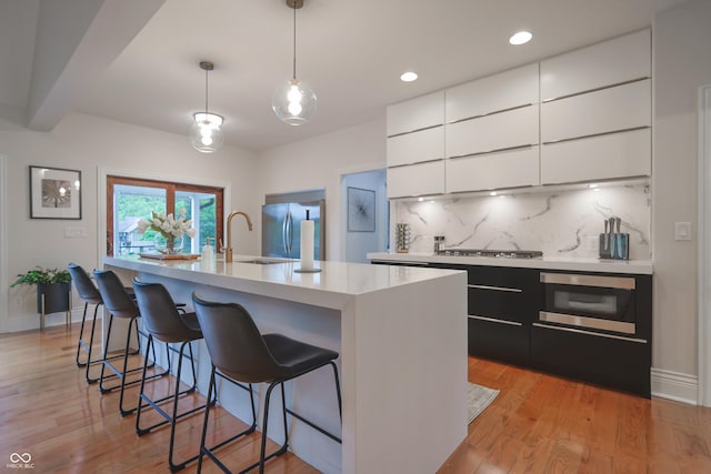 11911 W Grandview Dr, Columbus, IN 47201 - kitchen with modern cabinets, stainless steel built in refrigerator, light countertops, a sink, and backsplash
