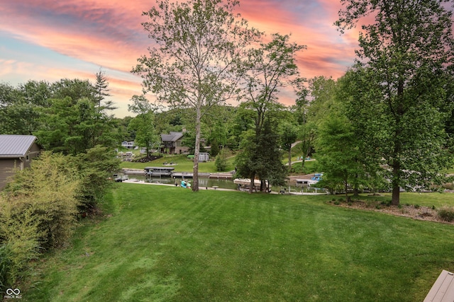 11911 W Grandview Dr, Columbus, IN 47201 - surrounding community with a yard, view of scattered trees, and a water view