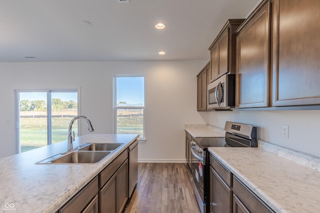 1108 Bevy Blvd, Danville, IN 46122 - kitchen featuring appliances with stainless steel finishes, a sink, dark wood-style floors, recessed lighting, and baseboards