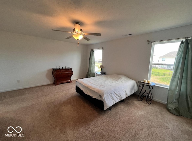 808 Capricorn Dr, Franklin, IN 46131 - bedroom featuring light carpet, baseboards, and ceiling fan