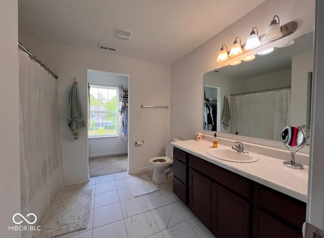 808 Capricorn Dr, Franklin, IN 46131 - bathroom featuring marble look tiles, vanity, toilet, and baseboards
