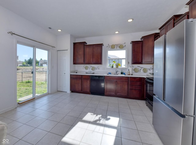 808 Capricorn Dr, Franklin, IN 46131 - kitchen featuring black appliances, light countertops, recessed lighting, a sink, and light tile patterned floors