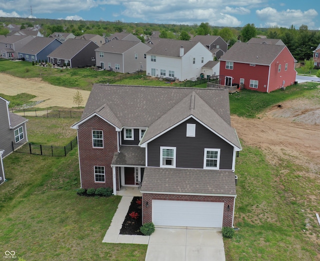 808 Capricorn Dr, Franklin, IN 46131 - traditional-style home featuring brick siding, a residential view, a garage, concrete driveway, and roof with shingles