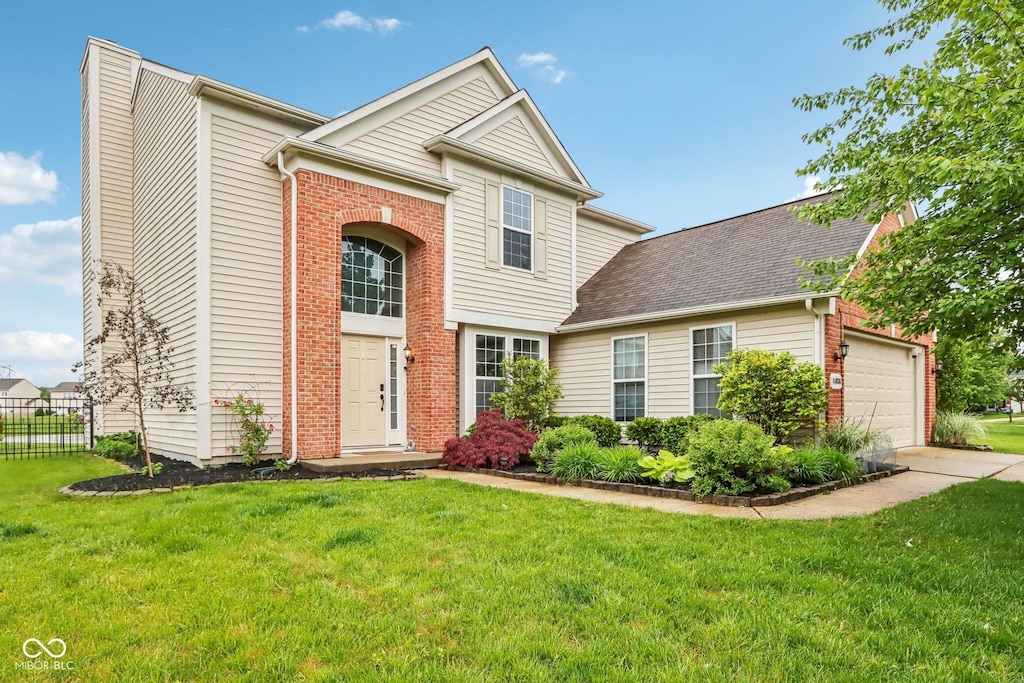 14036 Rayners Ln, Fishers, IN 46037 - view of front of property with an attached garage, brick siding, a chimney, and concrete driveway