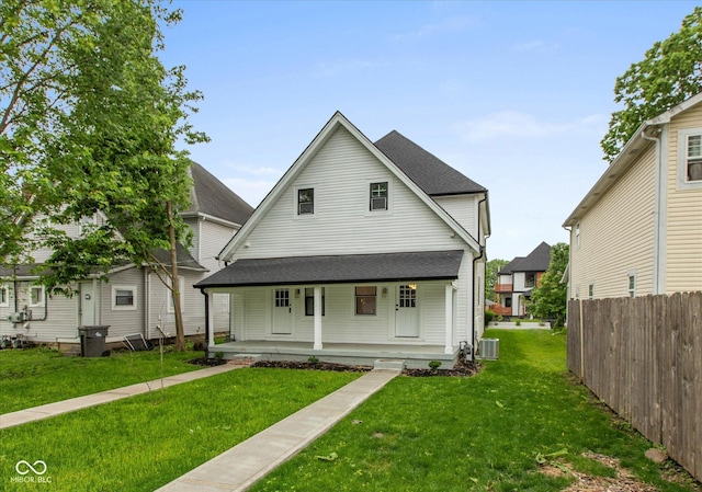 2623 Guilford Ave, Indianapolis, IN 46205 - view of front of home with covered porch, central air condition unit, and roof with shingles