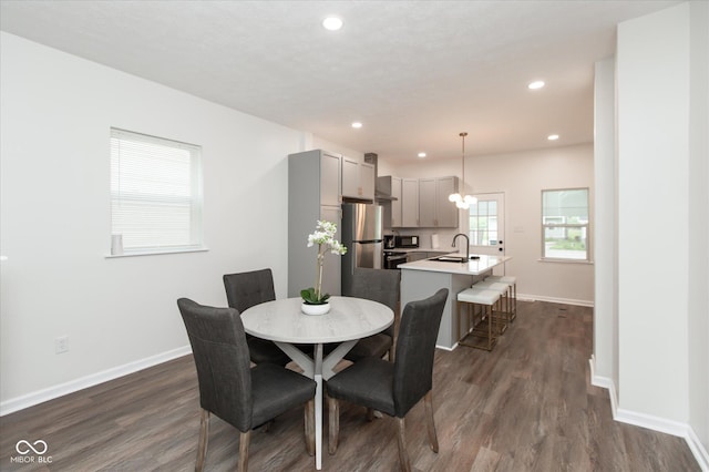 2623 Guilford Ave, Indianapolis, IN 46205 - dining room featuring dark wood-type flooring, baseboards, and recessed lighting