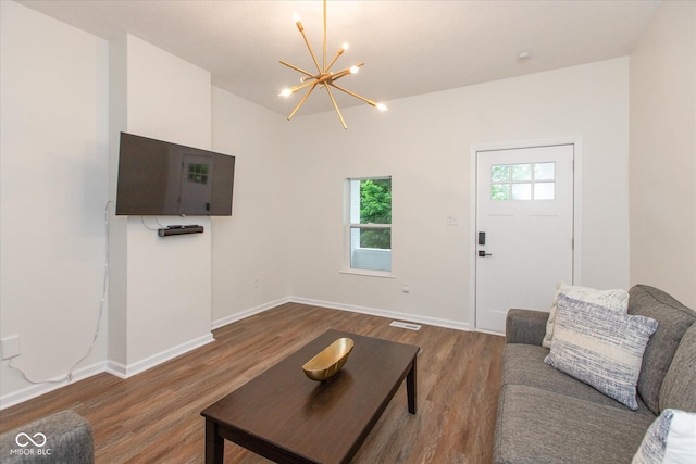 2623 Guilford Ave, Indianapolis, IN 46205 - living area featuring a chandelier, wood finished floors, and baseboards