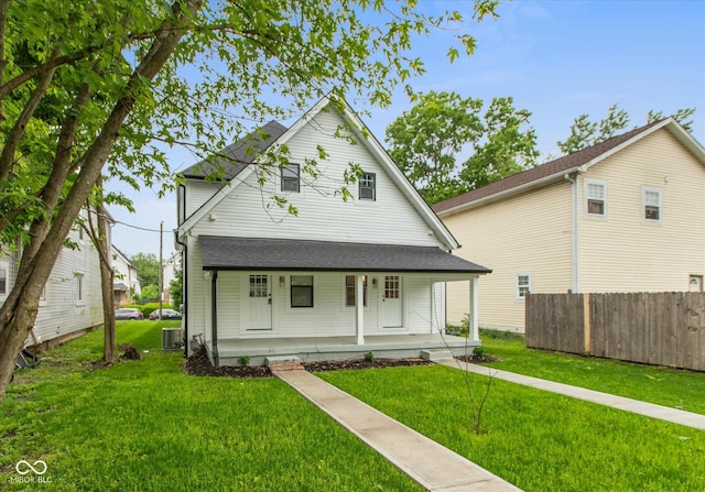 2623 Guilford Ave, Indianapolis, IN 46205 - view of front of house featuring covered porch, cooling unit, and roof with shingles