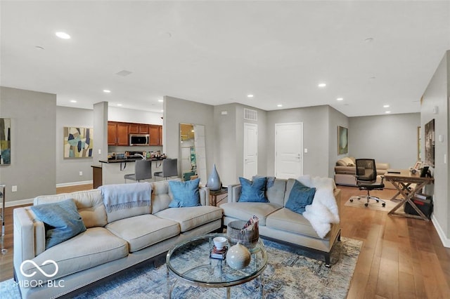 435 Virginia Ave Unit 108, Indianapolis, IN 46203 - living room with light wood-style flooring, recessed lighting, and baseboards