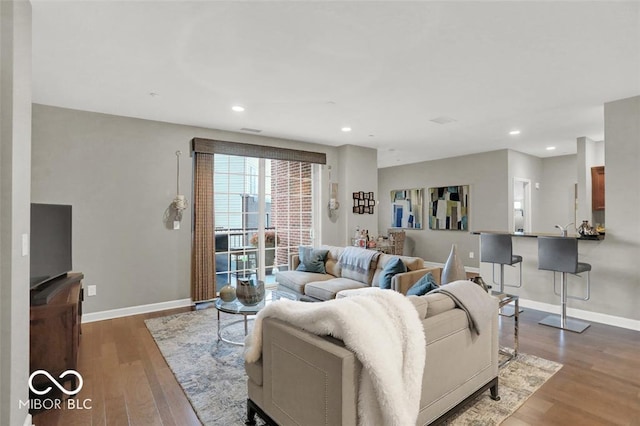 435 Virginia Ave Unit 108, Indianapolis, IN 46203 - living room featuring wood finished floors, baseboards, and recessed lighting