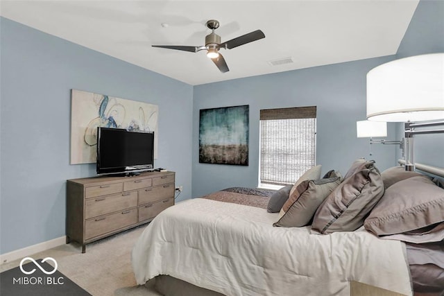 435 Virginia Ave Unit 108, Indianapolis, IN 46203 - bedroom featuring light carpet, a ceiling fan, and baseboards