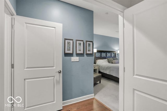 435 Virginia Ave Unit 108, Indianapolis, IN 46203 - hallway featuring wood finished floors and baseboards