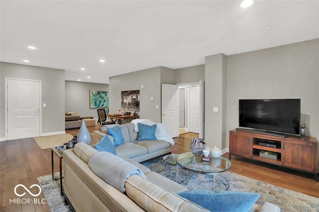 435 Virginia Ave Unit 108, Indianapolis, IN 46203 - living area with wood finished floors, recessed lighting, and baseboards