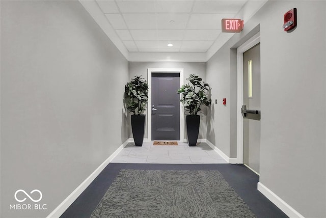 435 Virginia Ave Unit 108, Indianapolis, IN 46203 - corridor featuring a drop ceiling, baseboards, and recessed lighting