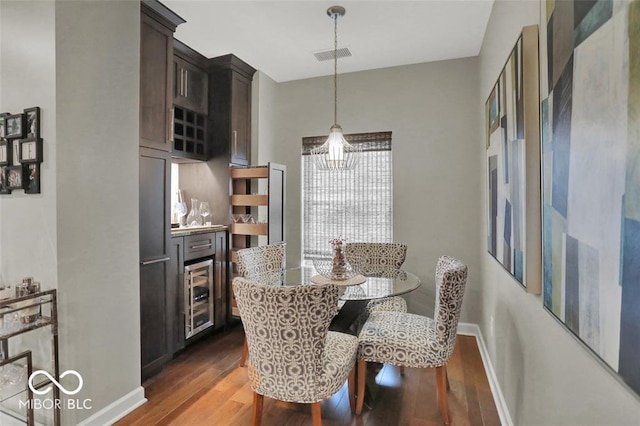 435 Virginia Ave Unit 108, Indianapolis, IN 46203 - dining room with beverage cooler, wood finished floors, and baseboards