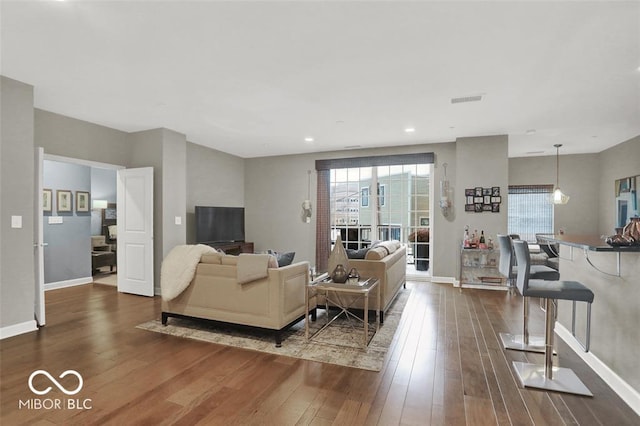 435 Virginia Ave Unit 108, Indianapolis, IN 46203 - living room with dark wood-style flooring, baseboards, and recessed lighting