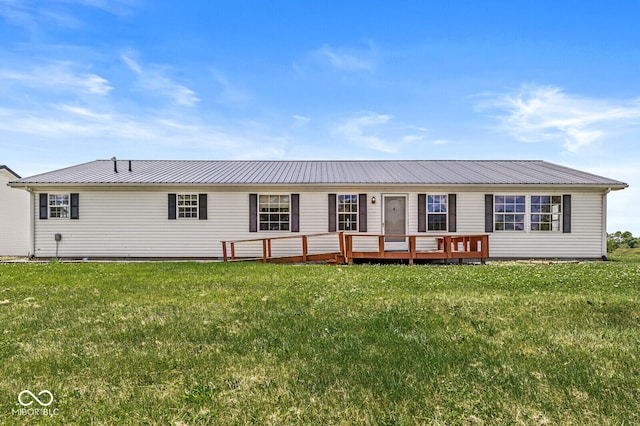 5428 S 525 W, Williamsport, IN 47993 - view of front of house featuring a front yard, metal roof, and a wooden deck