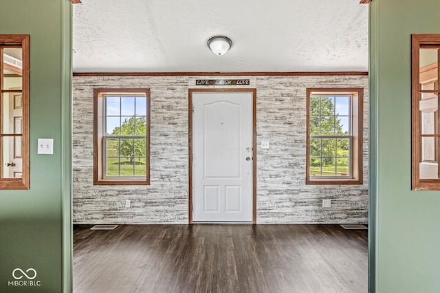 5428 S 525 W, Williamsport, IN 47993 - foyer entrance with a textured ceiling, wood finished floors, and crown molding