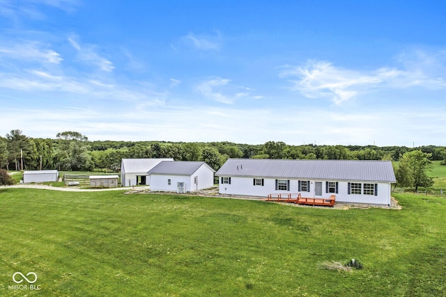 5428 S 525 W, Williamsport, IN 47993 - ranch-style home with a deck, a front lawn, and metal roof