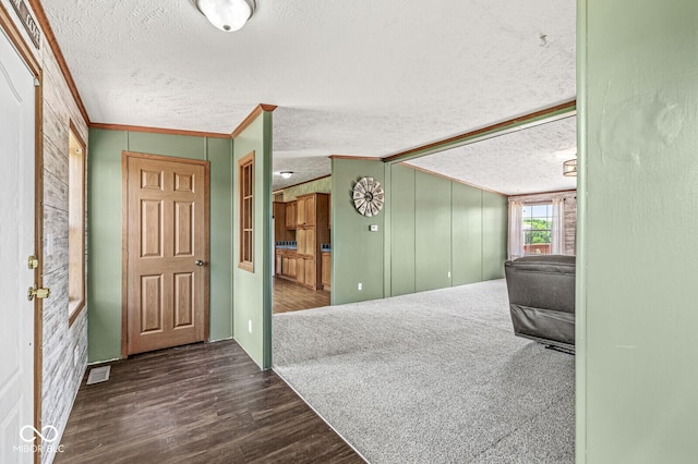 5428 S 525 W, Williamsport, IN 47993 - foyer entrance with a textured ceiling, crown molding, wood finished floors, and wood walls