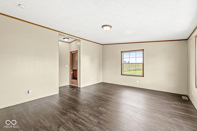 5428 S 525 W, Williamsport, IN 47993 - empty room featuring crown molding, dark wood finished floors, and a textured ceiling