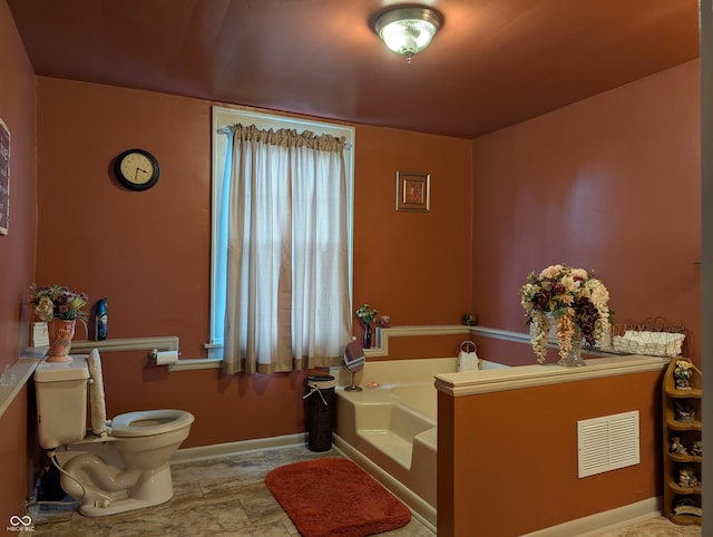 150 W Walnut St, North Vernon, IN 47265 - full bathroom featuring toilet, a bath, and baseboards